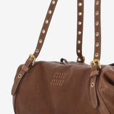 Close up of brown bag, showing texture of the leather fabric