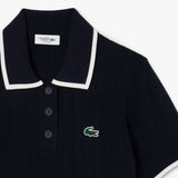 Close up of the navy knitwear, showing texture of the rayon and polyester fabric