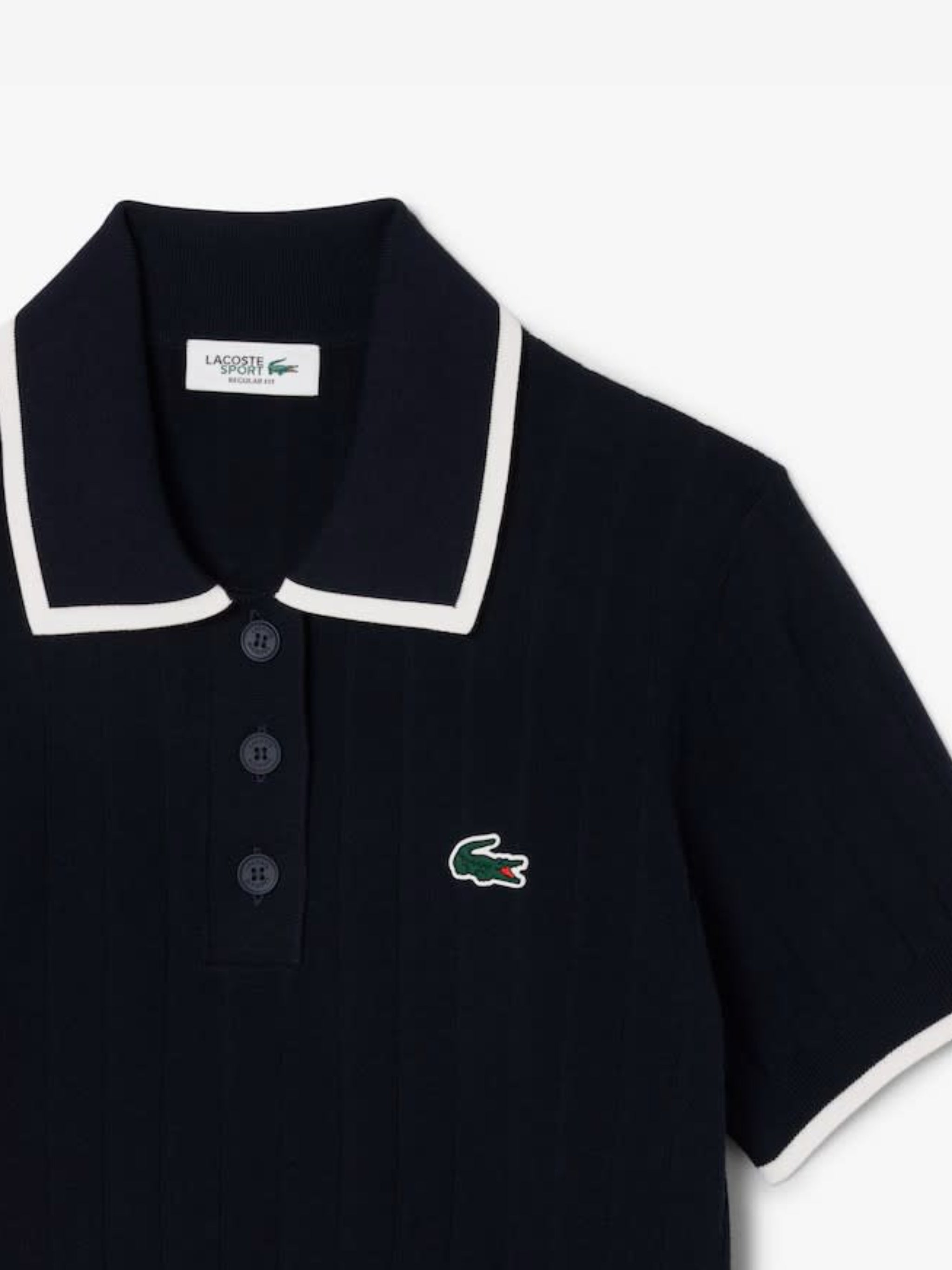 Close up of the navy knitwear, showing texture of the rayon and polyester fabric
