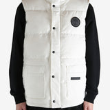 White vest worn by a person, showing the vest fit