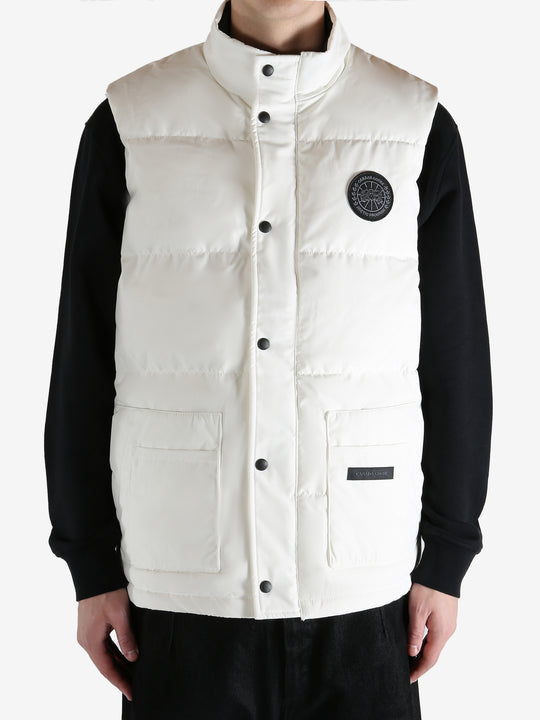 White vest worn by a person, showing the vest fit