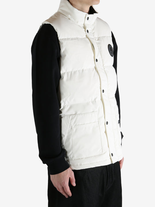 White vest worn by a person, showing the vest fit