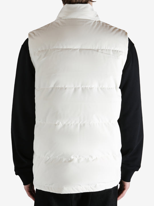 White vest worn by a person, showing the vest fit