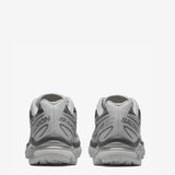 Grey sneakers, back view