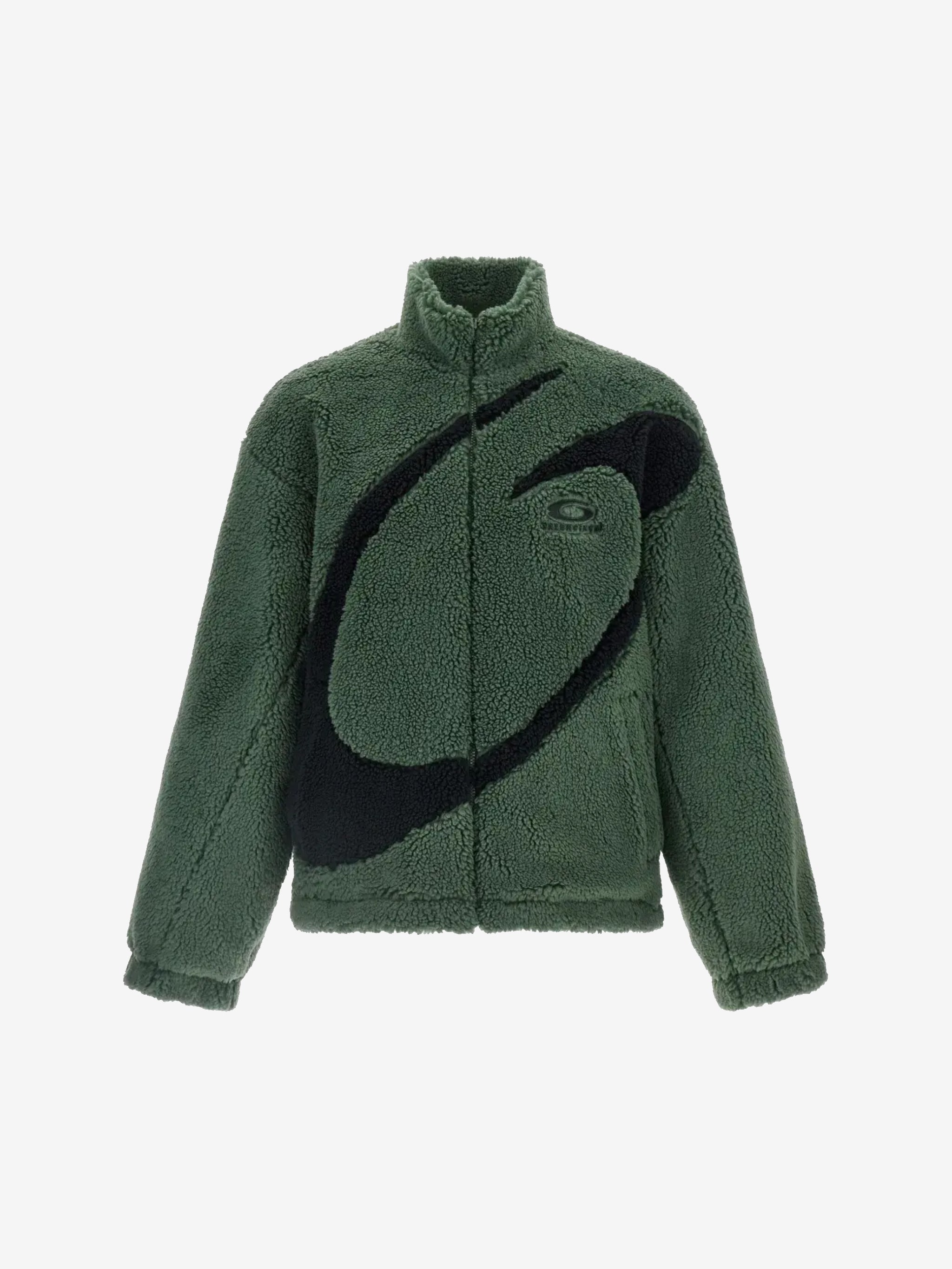 Green jacket worn by a person, showing the jacket's fit