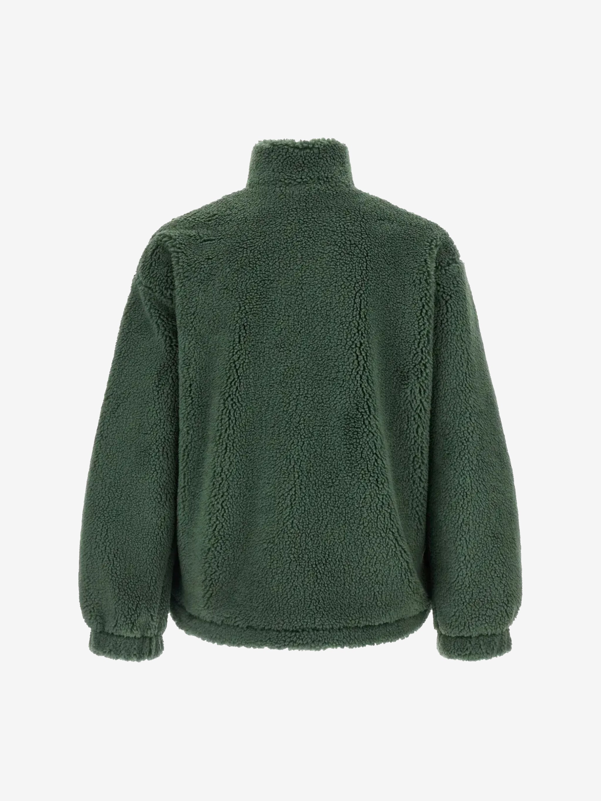 Green jacket worn by a person, showing the jacket's fit