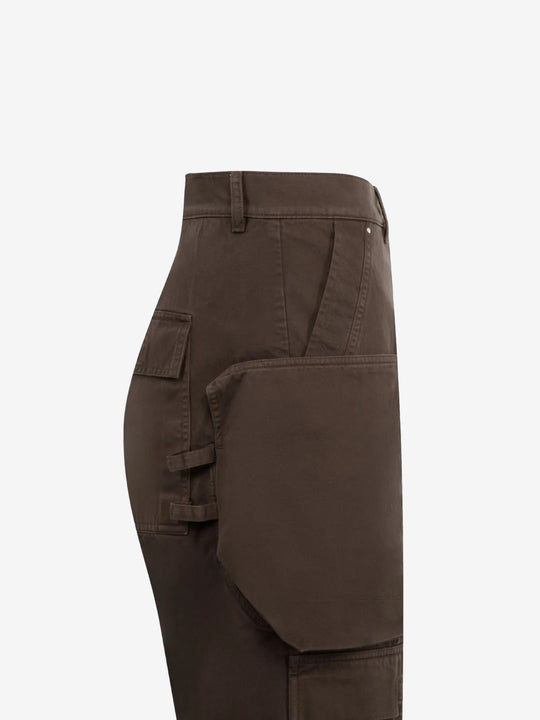 Close up of the brown pants, showing texture of the cotton fabric