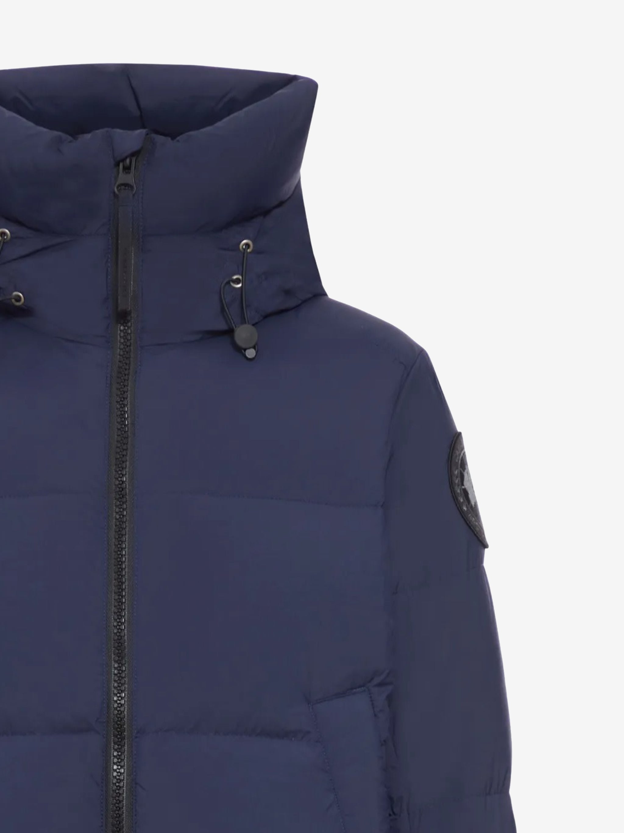 Close up of the navy coat, showing texture of the polyamide fabric