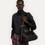 Black bag worn by a person, showing the bag fit