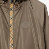 Close up of the brown coat, showing texture of the polyamide fabric