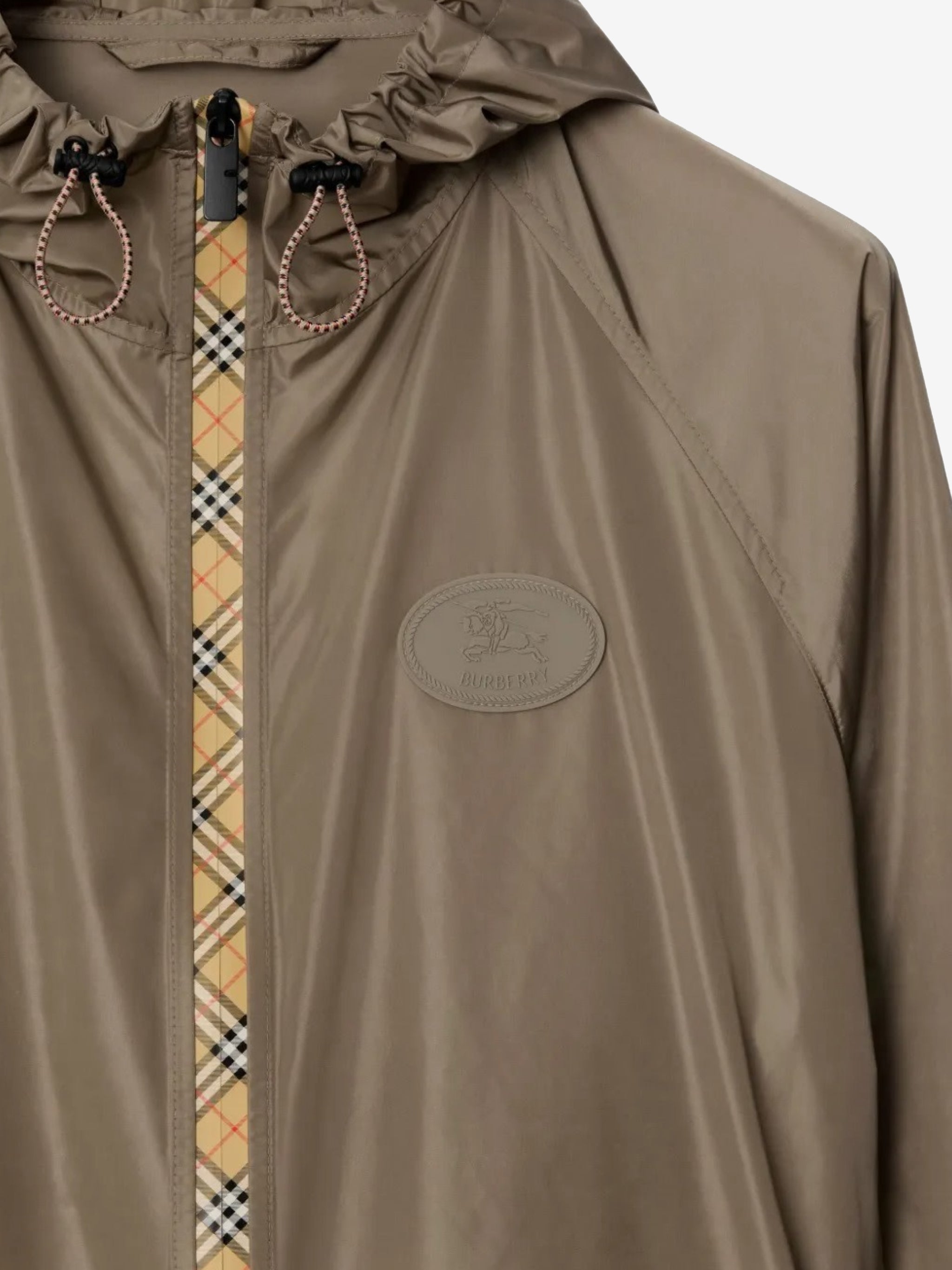 Close up of the brown coat, showing texture of the polyamide fabric