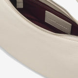 Close up of white bag,showing texture of the leather fabric.