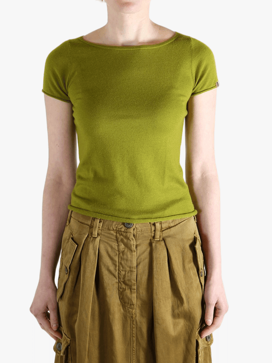 Green t-shirt worn by a person, showing the shirt's fit
