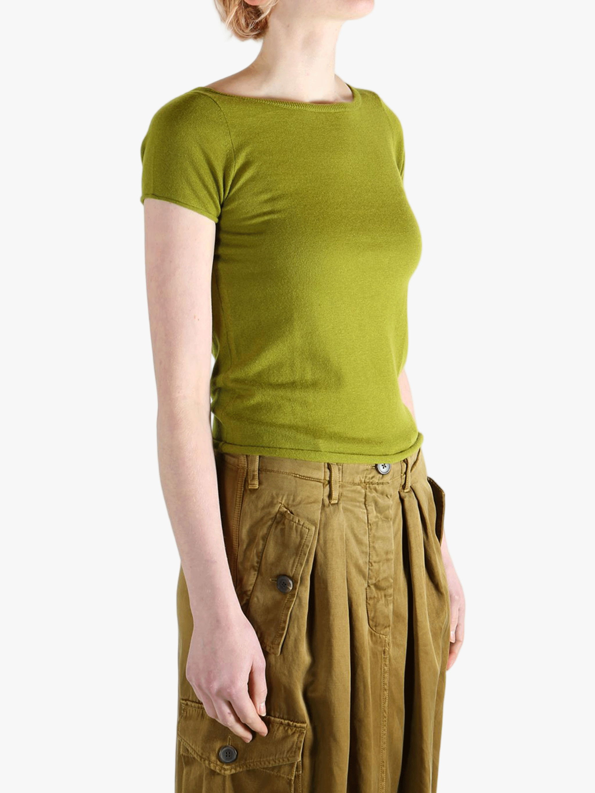 Green t-shirt worn by a person, showing the shirt's fit