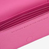 Close up of pink bag, showing texture of the leather fabric