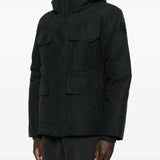 Black coat  worn by a person, showing the coat's fit