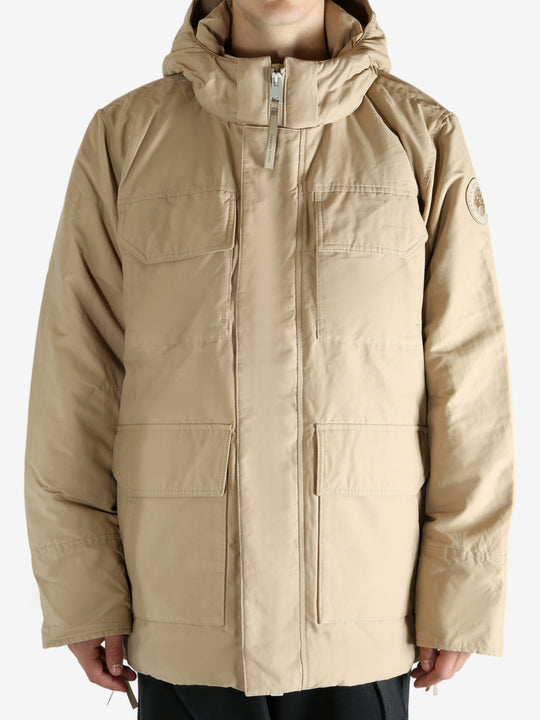 Tan coat worn by a  person, showing the coat's fit