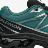 Close up of green sneakers, showing texture of the fabric