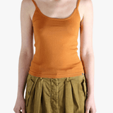 Orange tank top worn by a person, showing the top fit