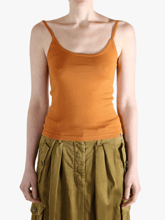 Orange tank top worn by a person, showing the top fit