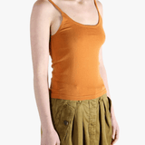 Orange tank top worn by a person, showing the top fit