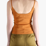 Orange tank top worn by a person, showing the top fit