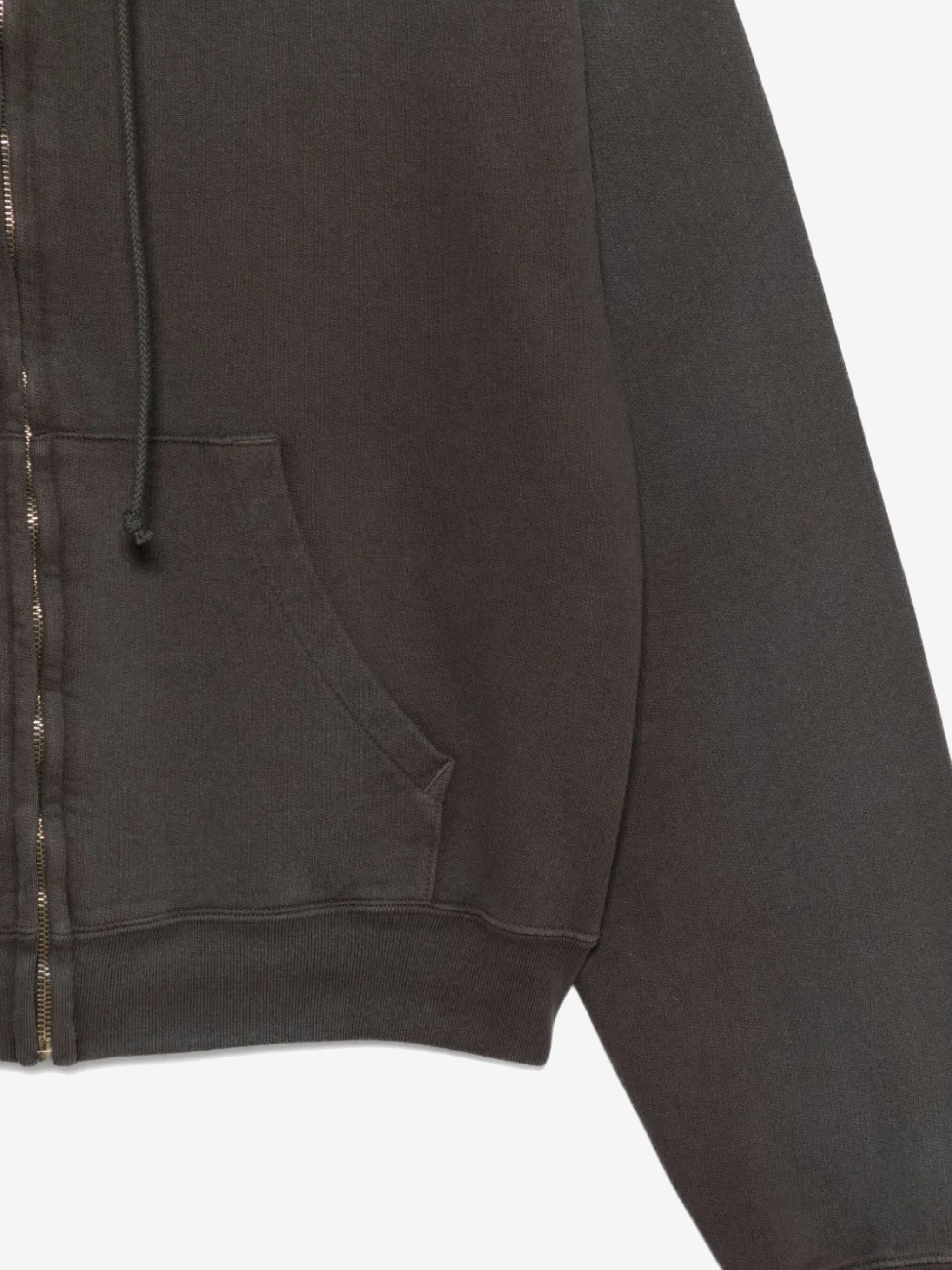 Close up of the black hoodie, showing texture of the cotton fabric