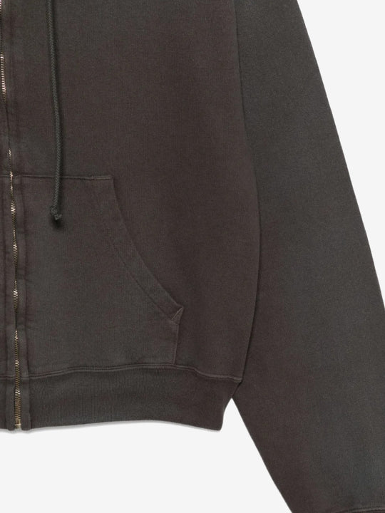 Close up of the black hoodie, showing texture of the cotton fabric