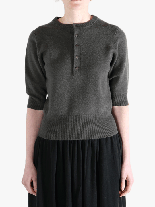 Dark gray sweater worn by a person, showing the sweater fit