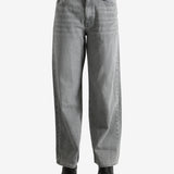 Gray jeans worn by a person, showing the jeans' fit