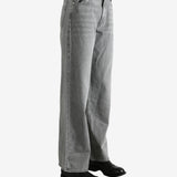 Gray jeans worn by a person, showing the jeans' fit