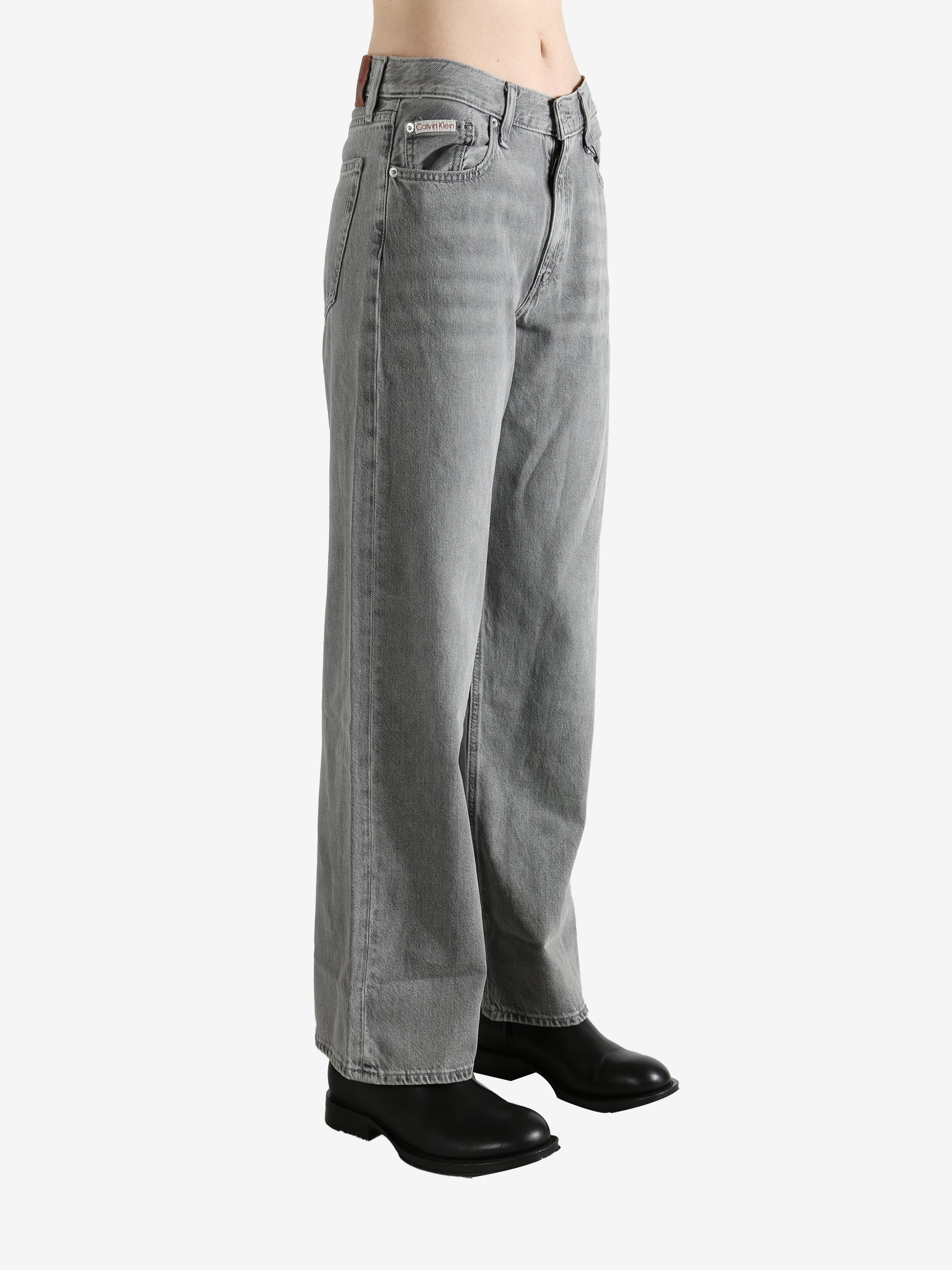 Gray jeans worn by a person, showing the jeans' fit