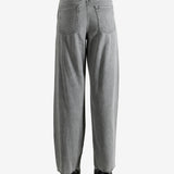 Gray jeans worn by a person, showing the jeans' fit