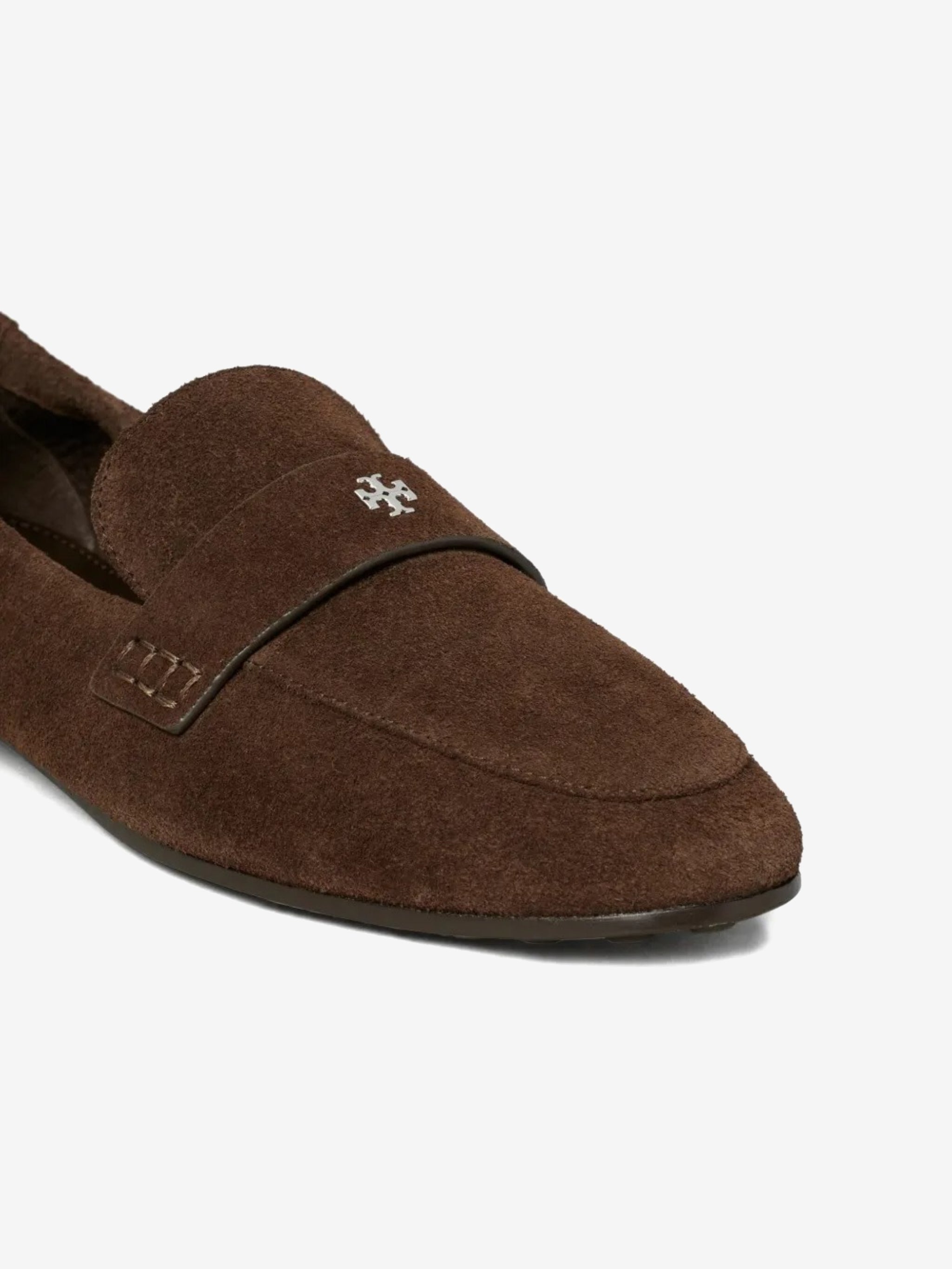 Close up of brown loafer, showing texture of the suede fabric