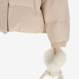 Close up of pink jacket, showing texture of the rabbit fur fabric