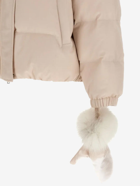 Close up of pink jacket, showing texture of the rabbit fur fabric