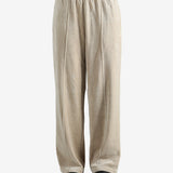 Tan pants worn by a person, showing the pants fit