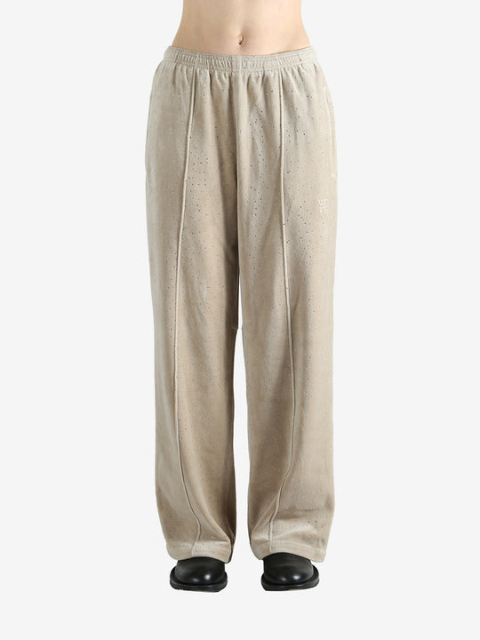 Tan pants worn by a person, showing the pants fit