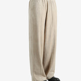 Tan pants worn by a person, showing the pants fit