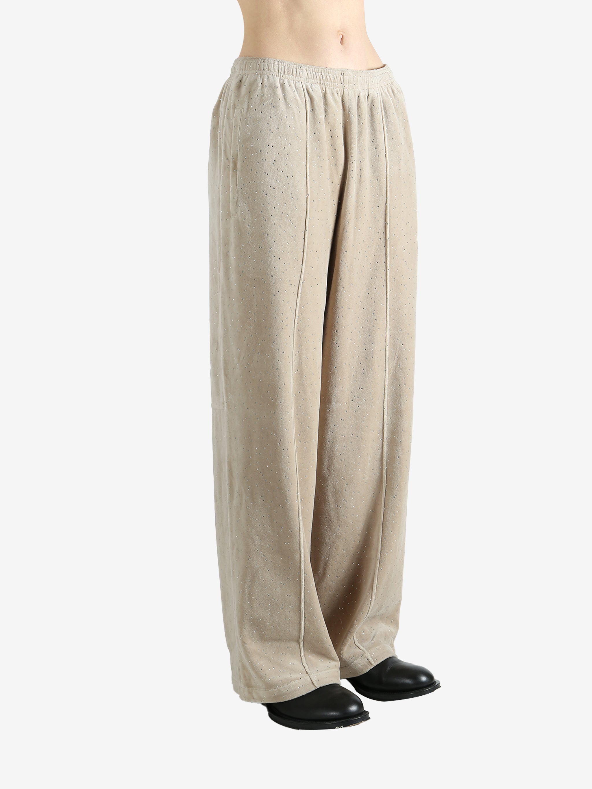 Tan pants worn by a person, showing the pants fit