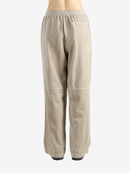 Tan pants worn by a person, showing the pants fit