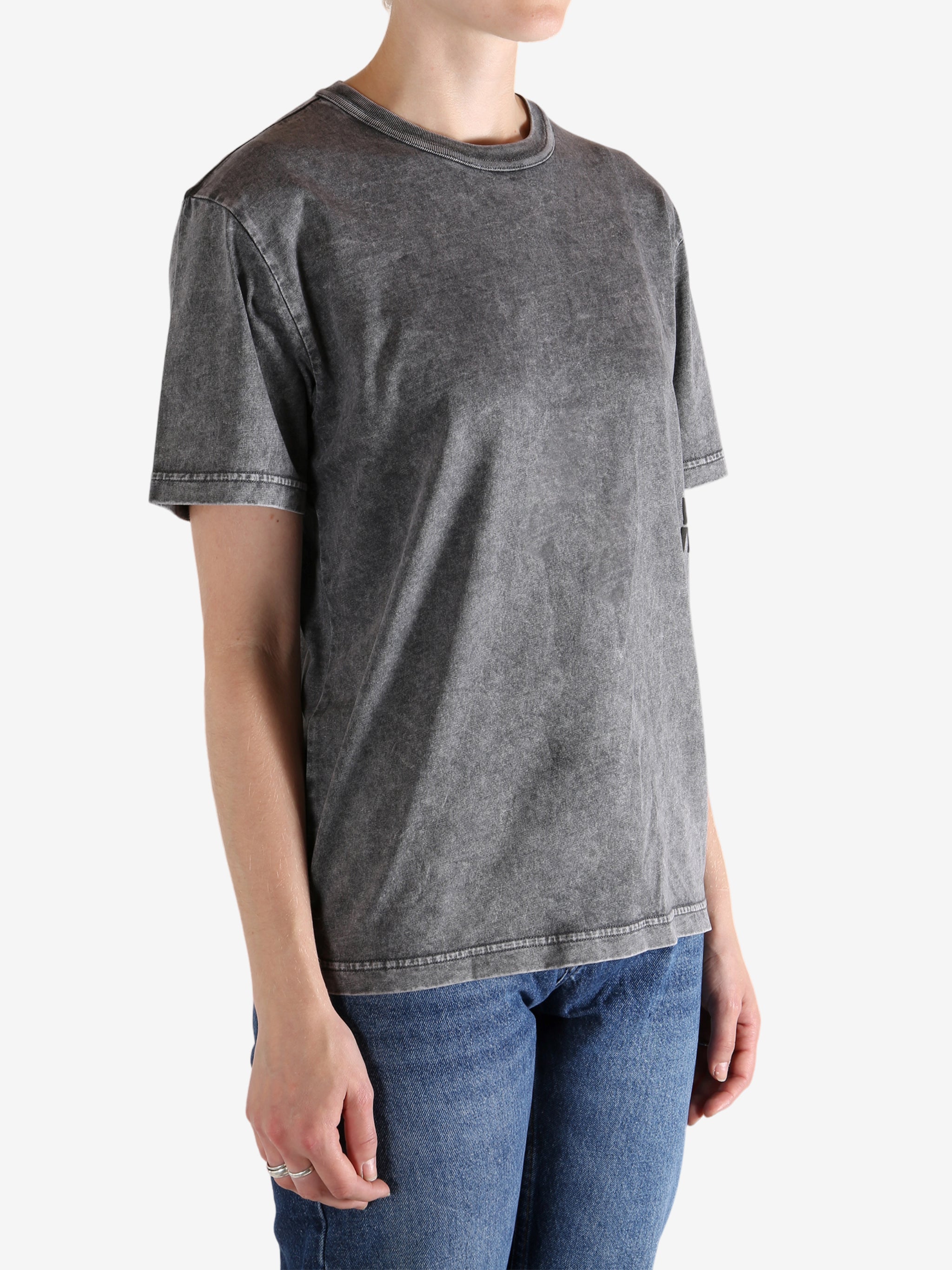 Grey shirts worn by a person, showing the shirts fit