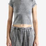 Grey t-shirt worn by a person, showing the t-shirt's fit