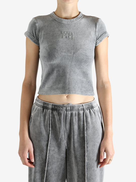 Grey t-shirt worn by a person, showing the t-shirt's fit