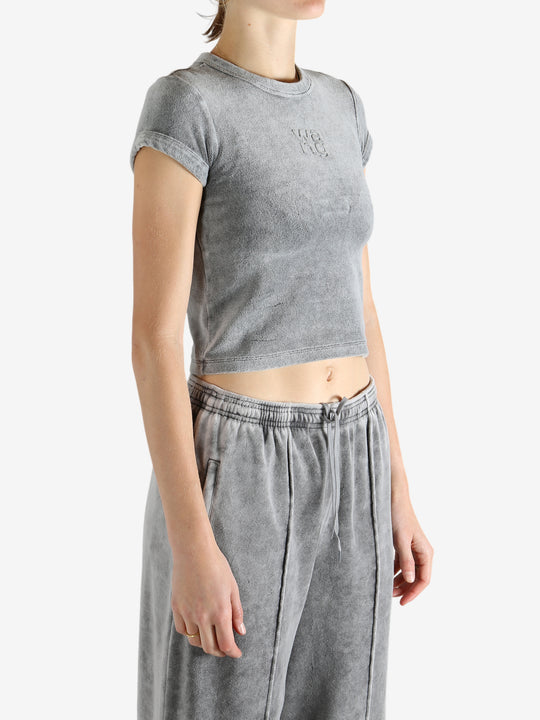 Grey t-shirt worn by a person, showing the t-shirt's fit