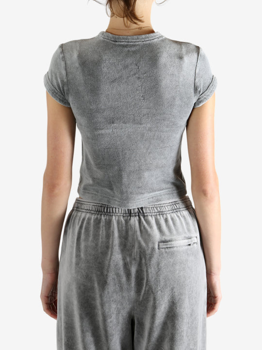Grey t-shirt worn by a person, showing the t-shirt's fit