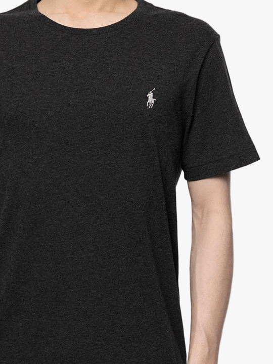 Close up of black t-shirt, showing texture of the cotton fabric