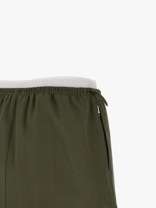 Close up of green skirts, showing texture of the Cotton fabric