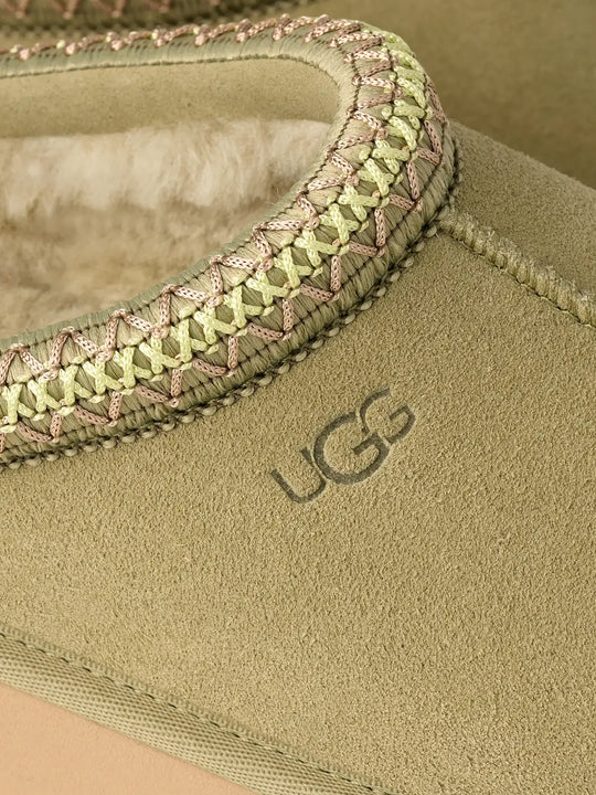 Close-up of a green shoes,showing texture of the suede fabric.