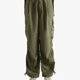 Green pants worn by a person, showing the pants fit